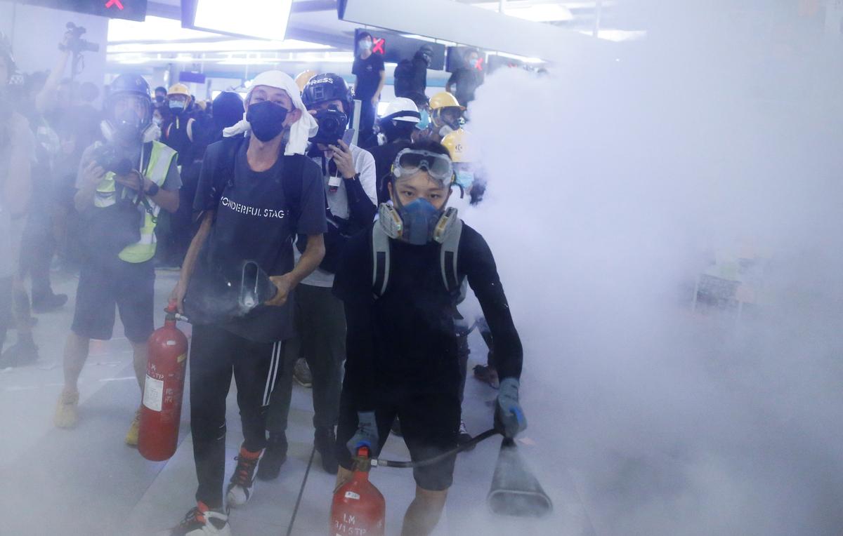 Hong Kong protesters clash with police, angry at lack of prosecutions after subway mob attack
